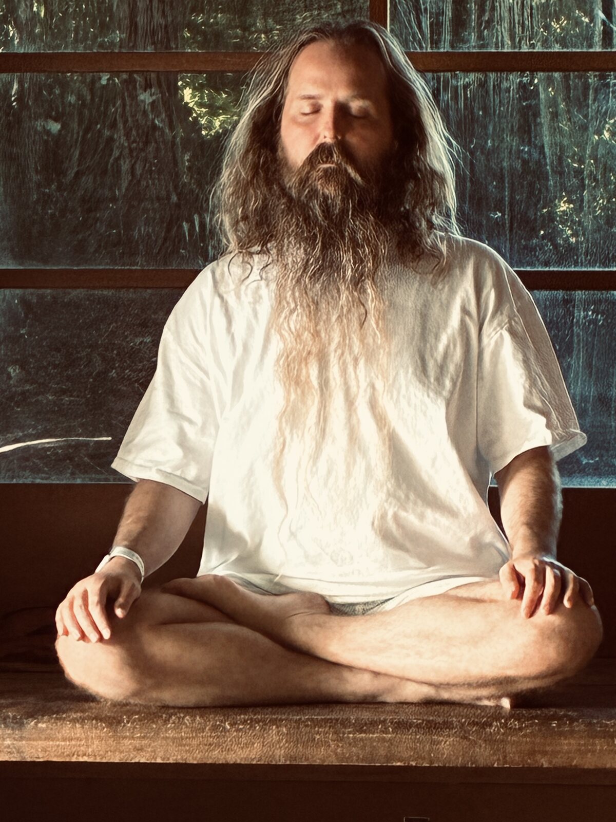 The Bhakti Math Guru, Adam Wes, seated in meditation