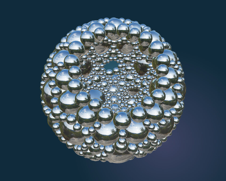 An Apollonian packing of reflective chrome spheres, revealing smaller spheres in the spaces between.